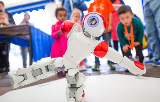 Visitors at Bradford Science Festival watching NAO robot, photographed by Jody Hartley