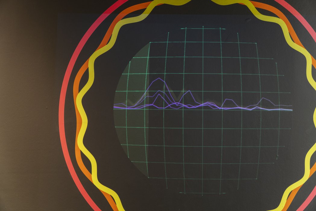 Close-up view of screen showing soundwaves